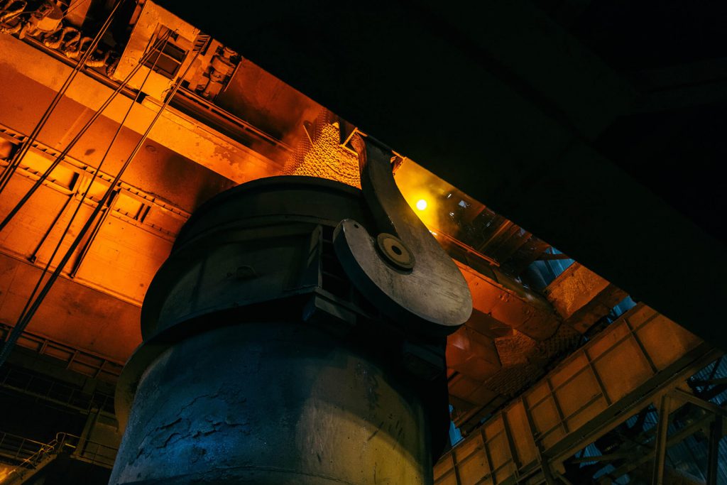 Ladle carrying molten steel in steelmaking plant.